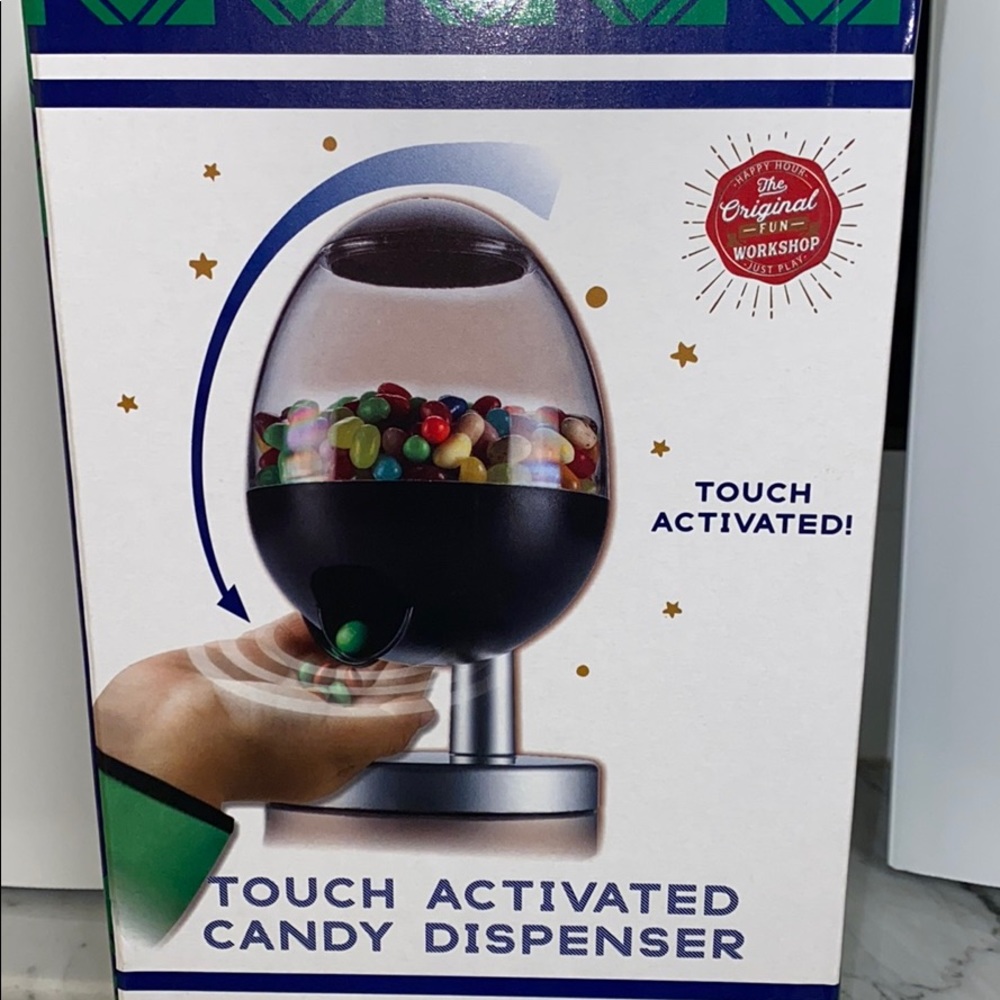 Touch activated candy dispenser